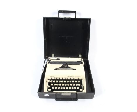 A cream 1970s portable Remington Ten Forty mechanical typewriter. Sperry Rand made in Holland s/n LY628134 in carry case L37c