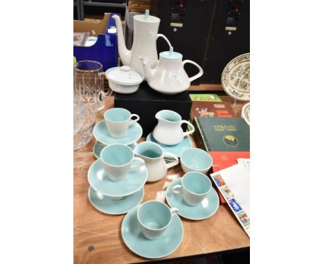 An Art Deco Poole Pottery part tea and coffee service in a mottled and green glaze.