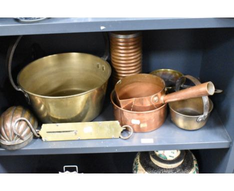 A selection of vintage copper and brass kitchenalia, including jam pan and jelly mould.