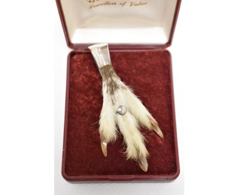 A vintage rabbits paw, having engraved thistle to silver plated mount.