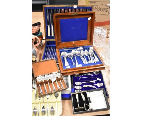 A selection of vintage canteens of cutlery, including bone handled knives and boxed babies spoon and pusher set.
