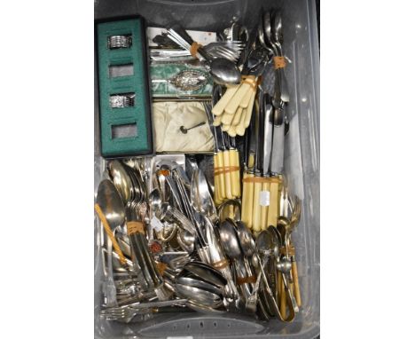A box full of vintage cutlery, boned handled knives, sugar nips, napkin rings etc amongst this lot.