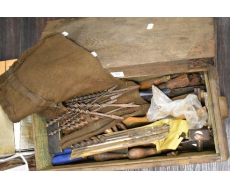 A mixed lot of vintage drill bits and hand tools, sheets of veneer, a rivet spinner and a chain breaker.