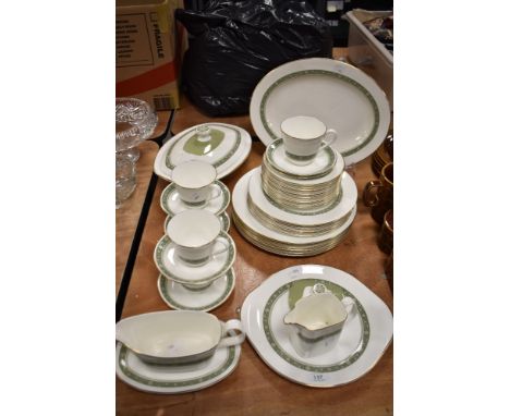 A partial Royal Doulton 'Rondelay' dinner service, comprising; plates, platter, tureen, jug, cups and saucers and gravy boat.