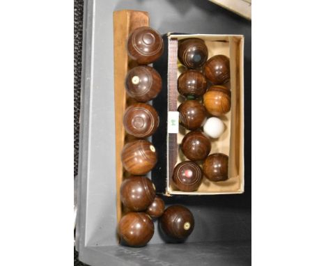 An assortment of vintage wooden carpet bowls/ boules.