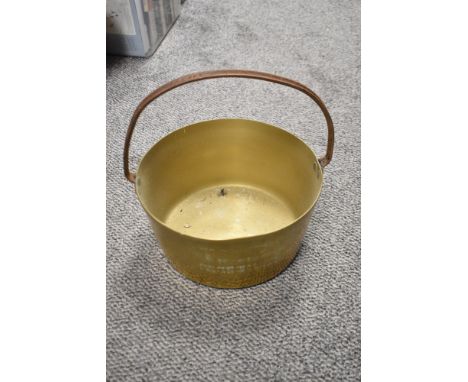 A vintage brass jam pan.