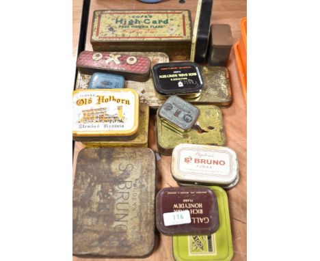 A collection of vintage advertising tins, including tobacco, Rivets and OXO.