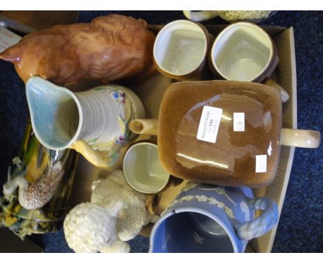 A selection of items to include three Carlton ware 'Hovis' mugs with watching tea pot and a Beswivk figure of a cat.