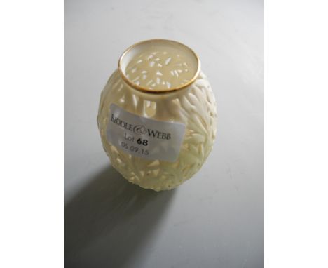 A small pierced Worcester plain vase with leaf decoration.