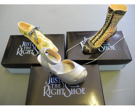 A collection of 'Just the Right Shoe' ceramic shoe ornaments.