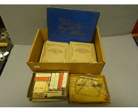 Box of vintage cigarette cards, mainly in albums