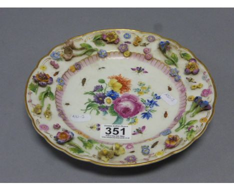 Ceramic plate with applied decoration and crossed swords mark to reverse