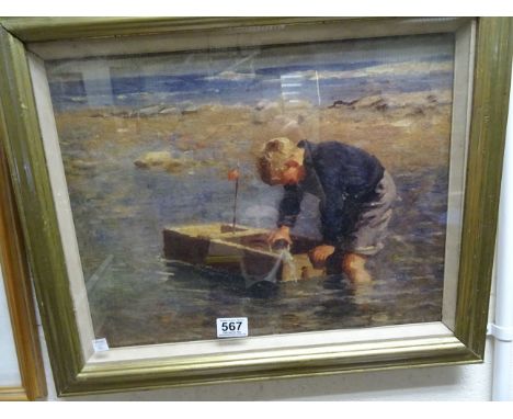 Gilt framed portrait on canvas of boy with boat in the shallows at the seaside