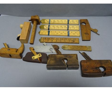 Box of vintage wood planes and folding rulers to include unused Rabone