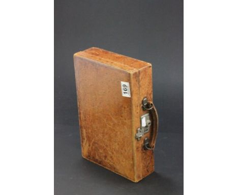 A vintage leather stationary case, with a leather handle
