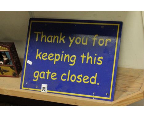 A metal sign "Thank you for keeping this gate closed"
