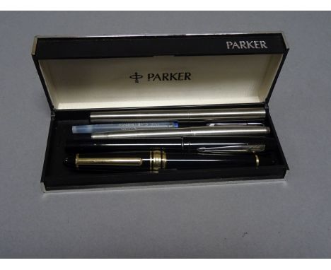 Four vintage pens including Parker in a Parker box