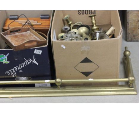 A brass fender, along with brass candlestick and others items 