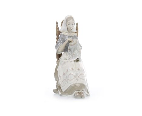 LLADRO FIGURE 'INSULAR EMBROIDERESS' designed by Salvador Furio, 1974-1994, seated on a ladder back chair, printed and impres