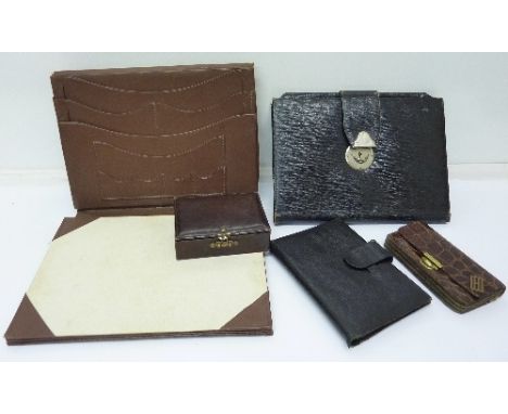 A crocodile skin handbag, a purse, two notebooks and a small jewellery case