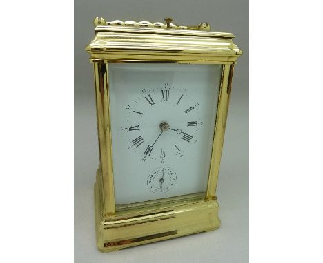 A brass four glass sided carriage clock with repeater movement, made in France, L'Epée, with key, height 15cm