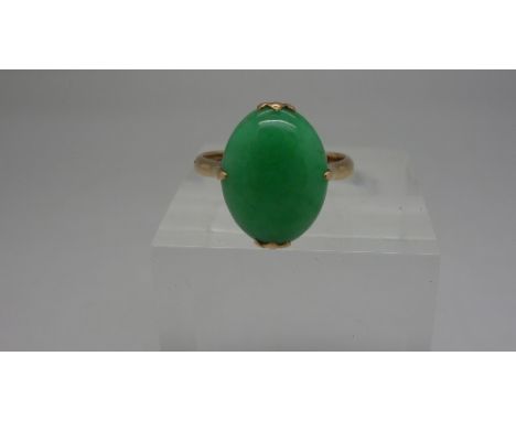 A 14ct gold and jade ring, weight 3.3g, size M