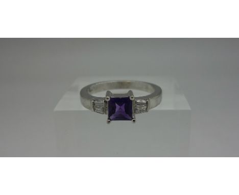 A 9ct white gold, purple stone and diamond ring, weight 3.2g, size K