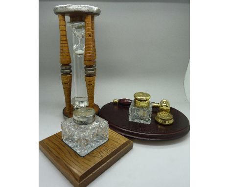 An inkstand with gavel, a timer and a silver topped inkstand with wooden base
