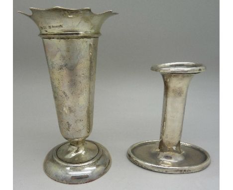 A silver candlestick and vase, height of vase 14cm