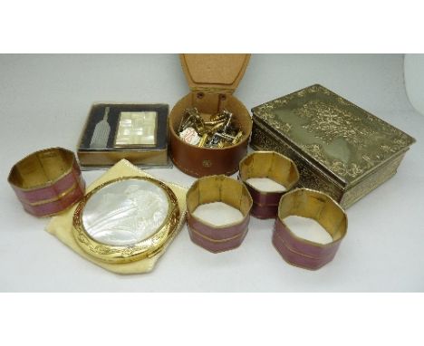 Cufflinks, a compact, napkin rings, etc.