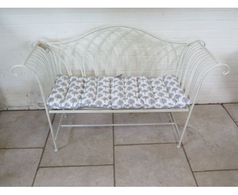 A new Ascalon cream painted metal bench, with cushion - 140cm wide 