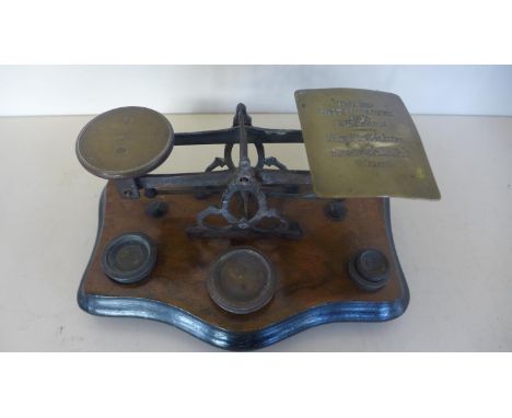 A set of postal scales with four weights 