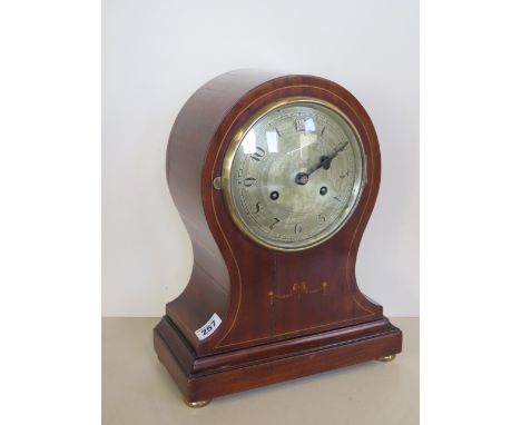 A mahogany balloon striking mantle clock 34cm tall 