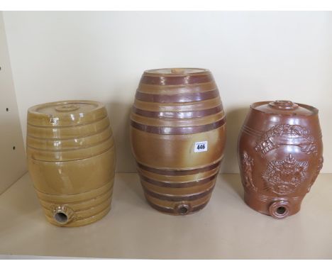 Three Victorian stoneware wine barrels, one with Royal coat of arms, tallest 35cm, all have some chipping 