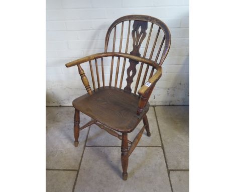 A 29th century ash and elm stick back Windsor armchair, 88cm tall 