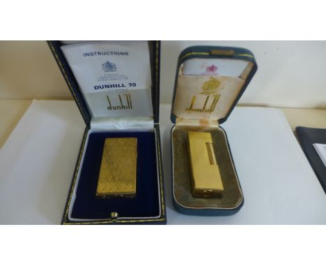 Two Dunhill gold plated lighters in original cases with papers, one Dunhill Rollagas, textured finish, light wear to case, sp