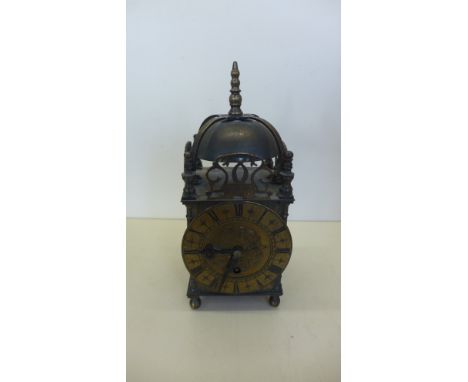 A brass lantern style mantle clock with an Empire spring driven movement, 25cm tall with key, in running order 