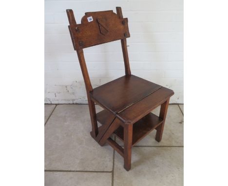A Gothic style Victorian oak fold over library step chair 