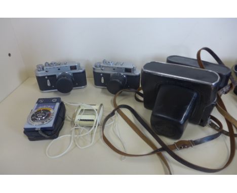 Two Zorki 35mm cameras, 4 and 4k both with cases and two light meters 