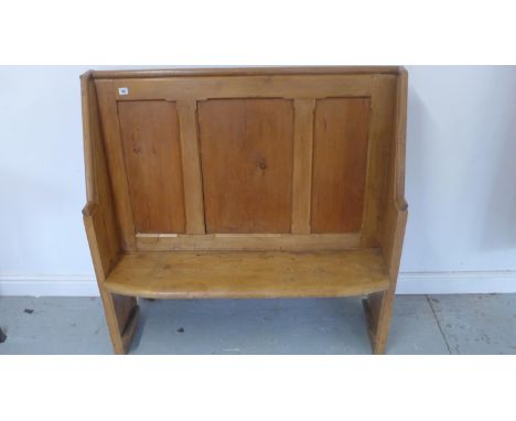 A pine hall bench with with a panelled back 117cm tall x 115 wide x 37cm deep 