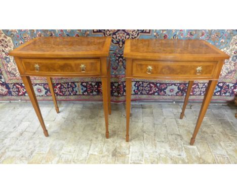 A pair of walnut bow fronted lamp tables, each with a frieze drawer on square tapering legs, 77cm tall x 61cm x 42cm - made b