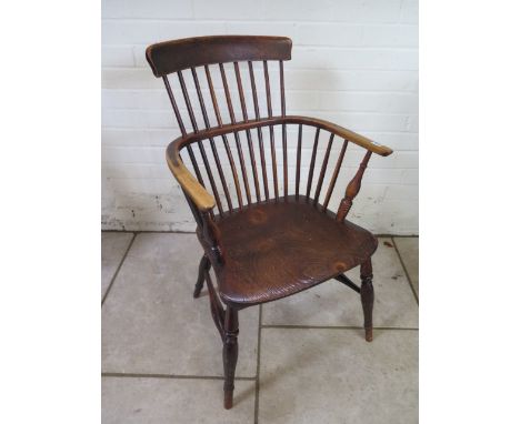 A 19th century ash and elm stick back chair on turned legs with good colours and patination, 90cm tall 