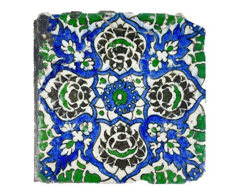 A Damascus pottery tile, Syria, 17th century, Painted with arabesque medallions and flowers, 16.5 x 16.5cm.