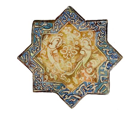 A Kashan lustre pottery star tile, Central Persia, 13th/14th century.  In the form of an eight pointed star, decorated in cob