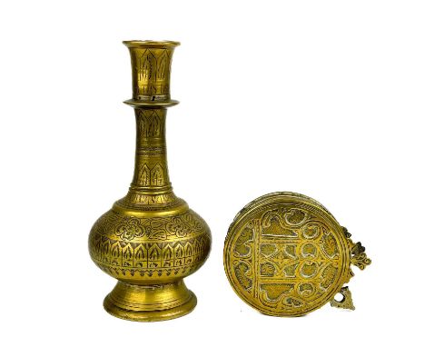 A Persian polished bronze huqqa base, 19th century.  Height 23.5cm, width 10cm and a Persian brass powder flask, 19th century