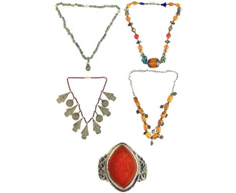 Moroccan Berber jewellery items. To include a silver amber, turquoise and lapis lazuli bead necklace, length 46cm; a buttersc