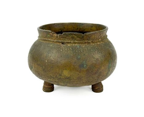 An Ashanti bronze kuduo 'gold dust pot', Ghana, 18th/19th century. Of squat bulbous form, the body engraved with geometric mo