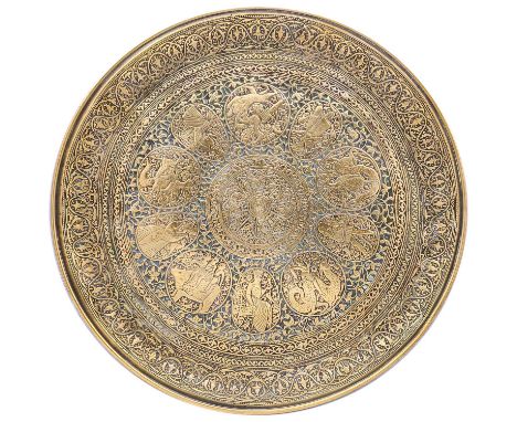 A Persian polished bronze salver, 19th century.  The central medallion filled with birds and tendrils within ten roundels enc