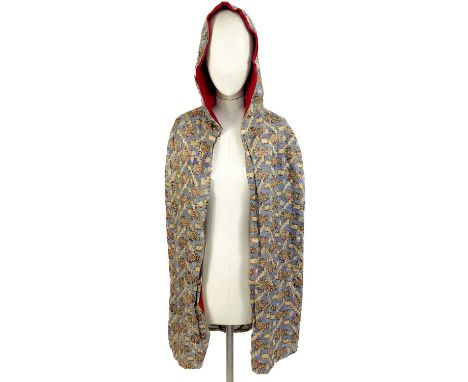 A Middle Eastern hooded cape, early 20th century. Decorated in silk and metal thread, full length 114cm.There is loss to part