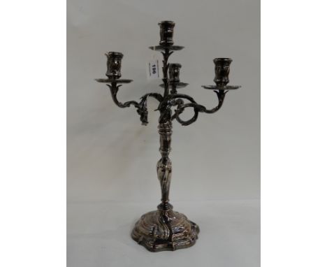 A German silver plated four-light candelabrum Condition Report: One of the sconce drip trays is bent out of shape, otherwise 